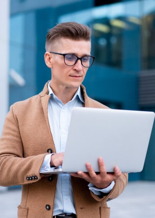 business-businessman-using-laptop-outdoor-adult-caucasian-male-business-person-eyeglasses-watching-notebook-screen-outside-serio