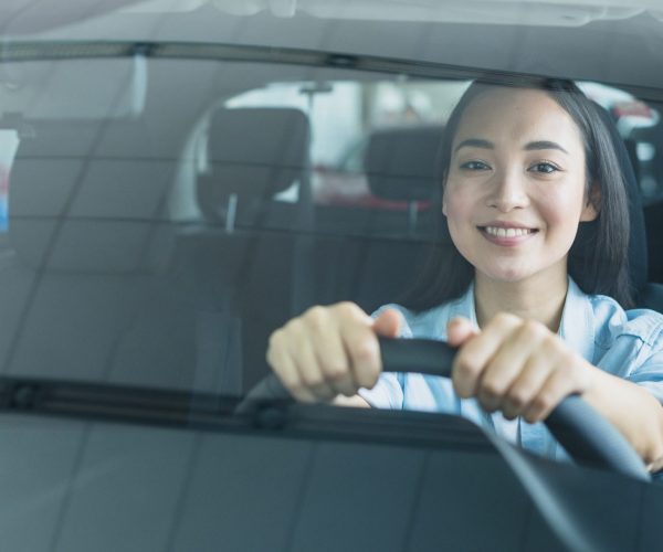 happy-woman-car-dealership